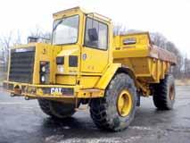 powered by Cat 3204 diesel engine and hydrostatic transmission, equipped with general purpose loader bucket with teeth, enclosed ROPS cab, and 15 DBG pads.
