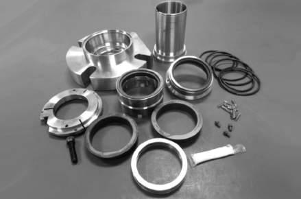 Remove both inboard stationary seal rings from gland assembly and discard.