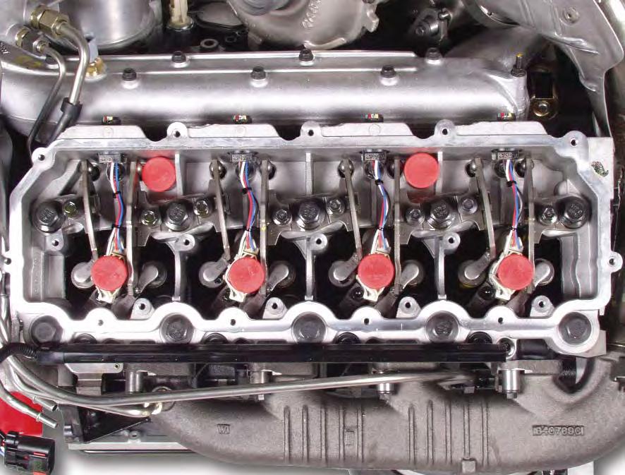 UNIQUE SERVICE PROCEDURES Cylinder Head - Rocker Carrier: Removal Before removing the rocker arm carrier the glow plug and injector connectors must be removed from the carrier.