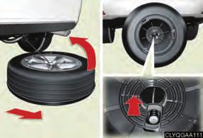 counterclockwise. Pull out the spare tire and remove the holding bracket.