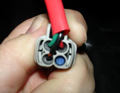 d. Locate blue plug on turn signal side connector.