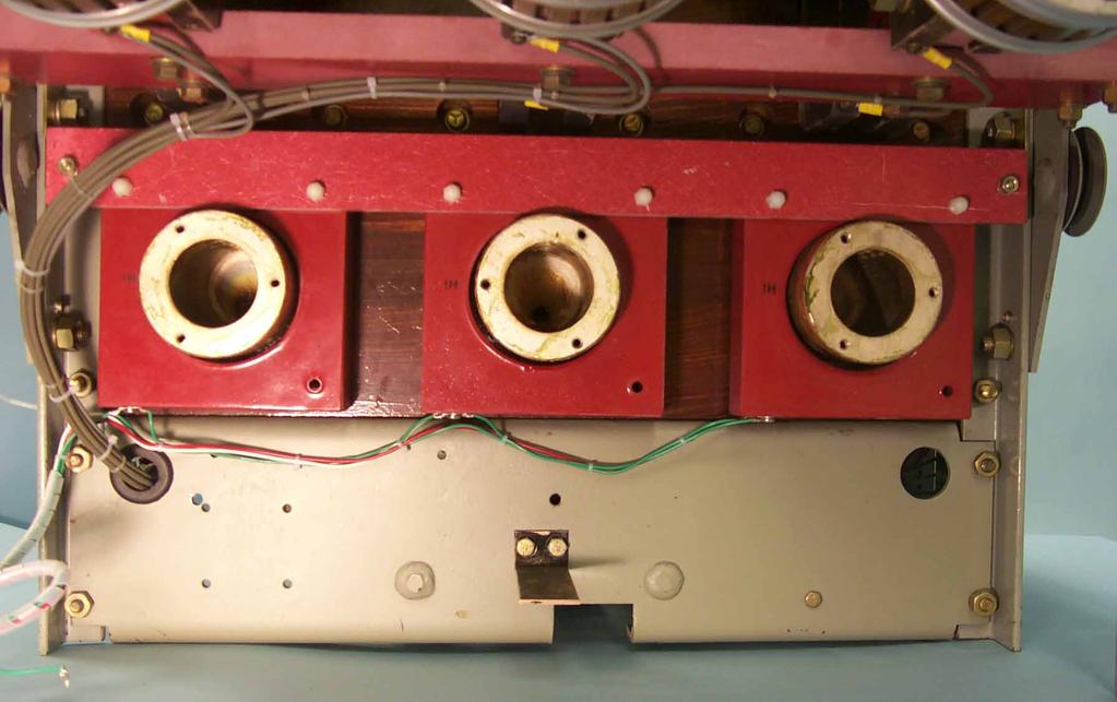 F. Set the Sensor Assembly in place on the bottom Breaker Connectors. Align the holes in the Sensor Assembly Mounting Clips with the holes from which the existing hardware was removed in Step 3-D.