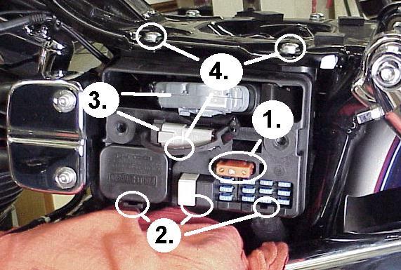 caddy for removal (4). Unplug the plug wires and harness from the coil and remove the caddy. module is transferred to the ThunderMax.