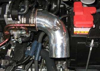 f. Install the supplied reducing coupler onto the throttle body