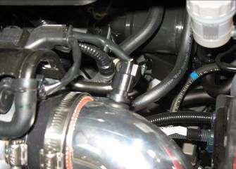 If the radiator hose is too close or touching, gently bend its support bracket for