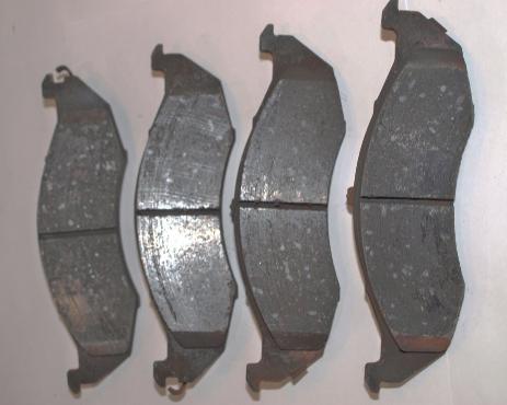 356 Chapter 14 Disc Brake System Principles FIGURE 14-31 An example of pads with grooves for dust dispersion and chamfered edges to reduce noise. The groove also provides an indication of wear.