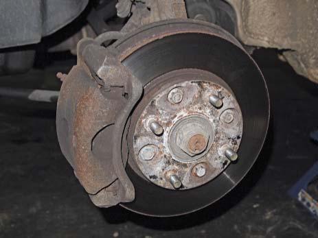 Rear brake rotors can be either vented or solid, depending on the requirements of the vehicle. Figure 14-37 and Figure 14-38 show a front and rear disc brake assembly for comparison.