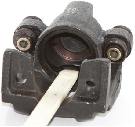 s that are bolted to the knuckle often use a combination mounting bolt and sleeve that rides in the caliper body, as shown in Figure 14-19.