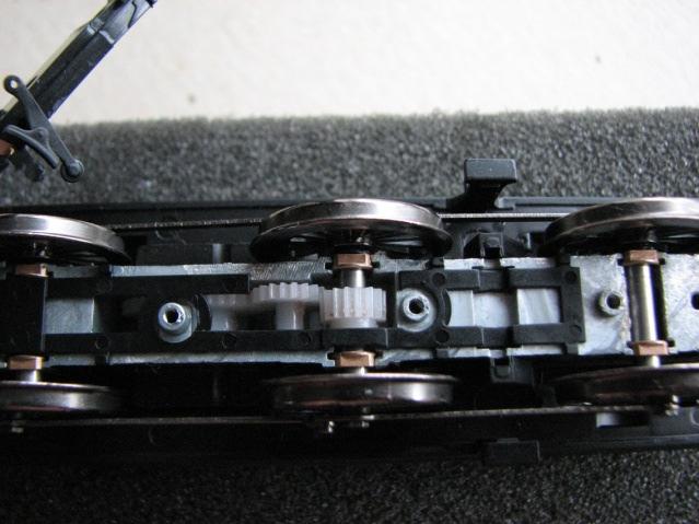 Unclip the brake pull rods, and undo the screws holding the keeper plate, it will lift away from the rear and unhook from the front of the chassis. This exposes the wheel sets and bearings.