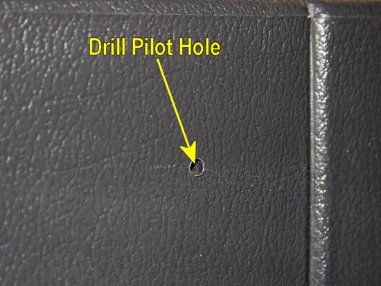 18. Use a punch, or something similar, to mark the hole through the paper.