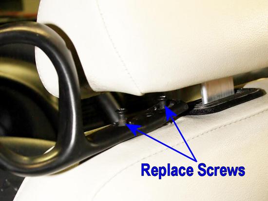 50. Remount the seat belt loop onto the seat, and