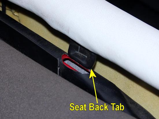4. At both top corners of the seat back, there s a tab that fits into