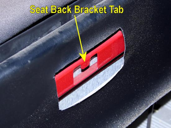 6. With the seat back removed, you can see the tab that secures the bracket