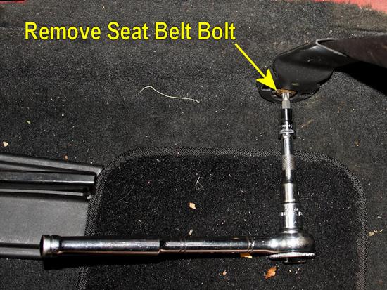 12. Use a T-45 Torx bit and socket wrench to free the end of the seat belt