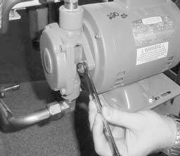 If the pump needs to be replaced, loosen one inch nuts from the outflow and inflow lines. Then remove the two bolts holding the pump to the motor with a 1/2 inch wrench. 2.