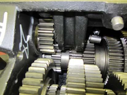 Push the upper Reverse Idler Gear towards the outside of the case (away from the Main Shaft). 15.