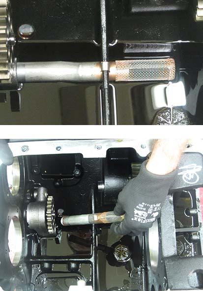 Remove the Main Feed Tube assembly from the Transmission Case by pulling the