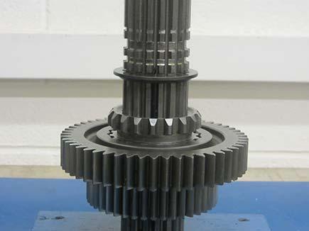 Main Case Main Shaft Assembly with Low Force Gearing Service Procedures TRSM0940 7. Install the stepped washer.