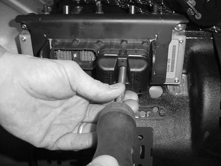 Using a 5/32 wrench, reconnect the Transmission Harness 38-way Connector and tighten to 25 +/- 3 lb-in (2.82 +/- 0.33 N m).