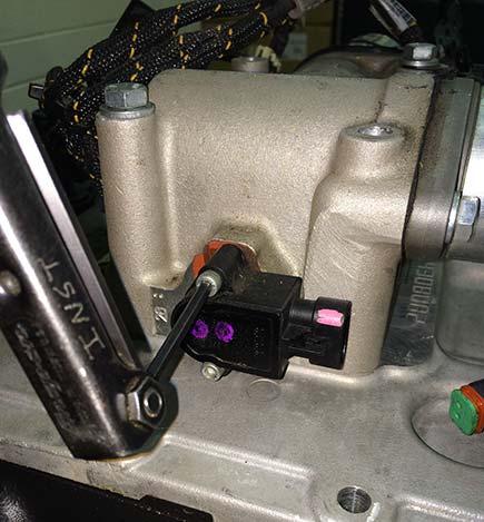 Then, insert Gear Position Sensor, with gasket, into its mounting location.
