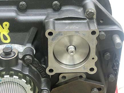 Install a new gasket between the Range Cylinder and the Range Cylinder Cover.