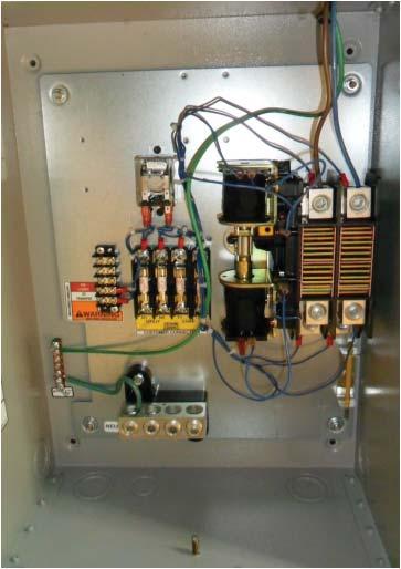 The installer will need to make a hole in the enclosure to run the incoming conductors from the utility disconnect through the transfer switch.