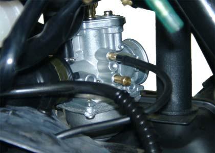 With the sealing washer attached, apply cupper grease, and thread the spark plug in by hand to prevent cross threading. Tighten the spark plug with 1.5-2kg-m 3.