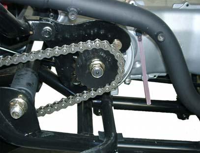 Tighten the our lock bolts. Apply chain lubricant to lubricate the drive chain.