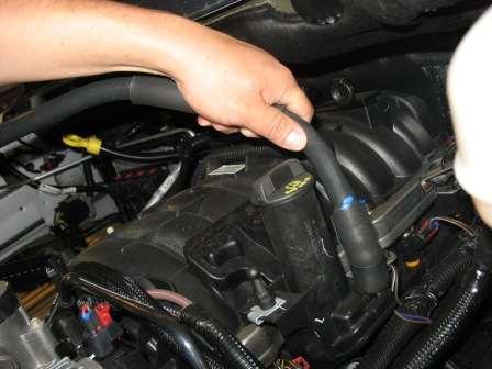 Remove the breather tube and hose from the engine. 3.