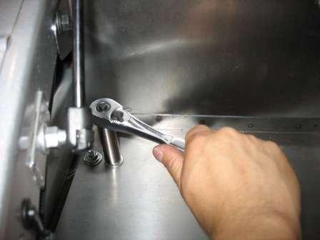 Secure the front tab of the bracket to the vehicle using
