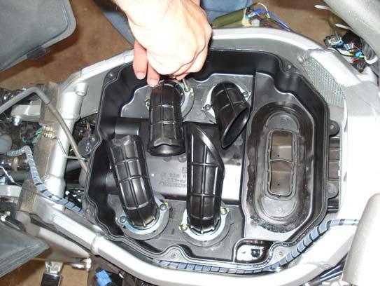 22. The two bottom hoses, the bottom portion of the air box, snorkels, and air filter is re-installed.