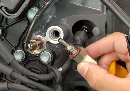 Apply Hondabond HT (ThreeBond #1201 or #1215 or equivalent) to the threaded part of the ECT2 sensor.
