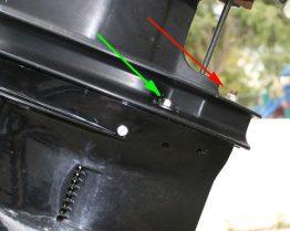 Newer models use a 1/2 hex head, while some older units use a 3/8 allen head. Remove the bolt and trim tab. 1.5 Below the trim tab is bolt which must be removed.