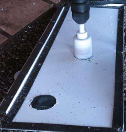 Drill the holes as marked on the interior food zone cover. The final hole diameter should be 1 ¾ for each fitting.