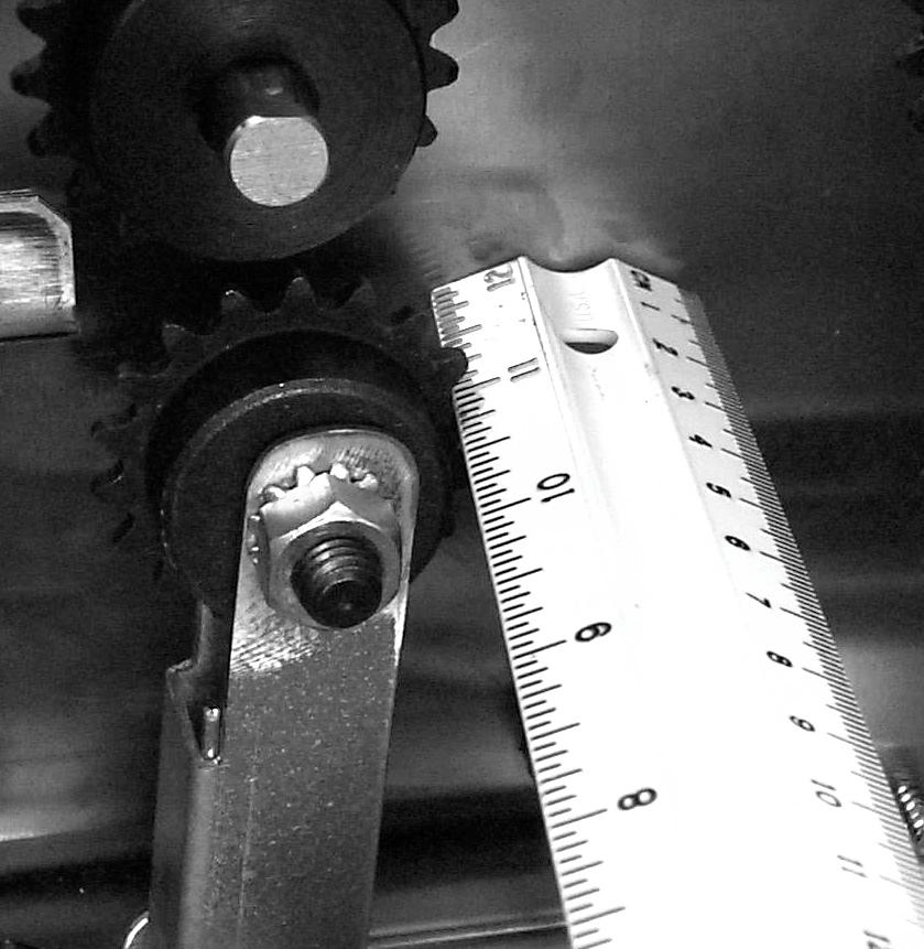 Drape the new chain, which is prelubricated, on the drive sprocket and the new upper idler, which should not be attached to the toaster at this point. Route the chain as shown in Fig. 6.
