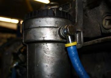Drain the fuel from the factory filter housing. Remove the Support Bracket Bolt.