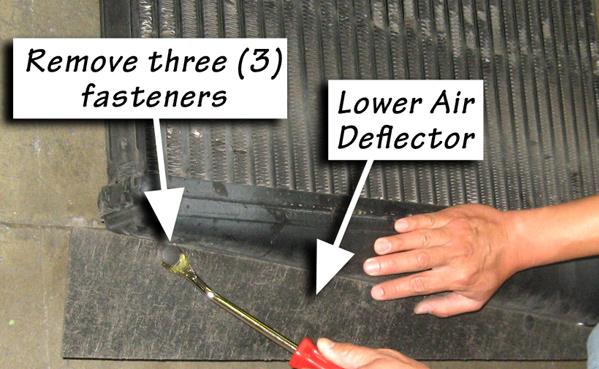 7. Remove the lower air deflector fastener on the bottom of the CAC. See Figure 7. Remove the air deflector and retain for re-use. Note: An upholstery tool can ease remove of air deflector fasteners.