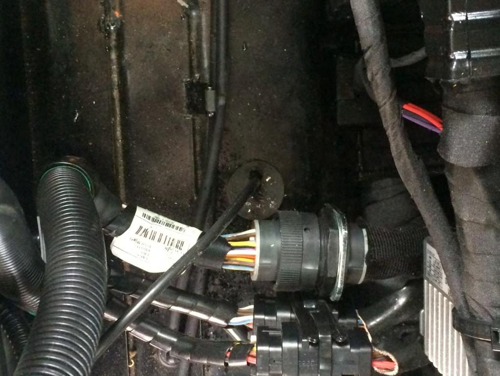 The power cord passes into the cab through an unused grommet located on the cab floor