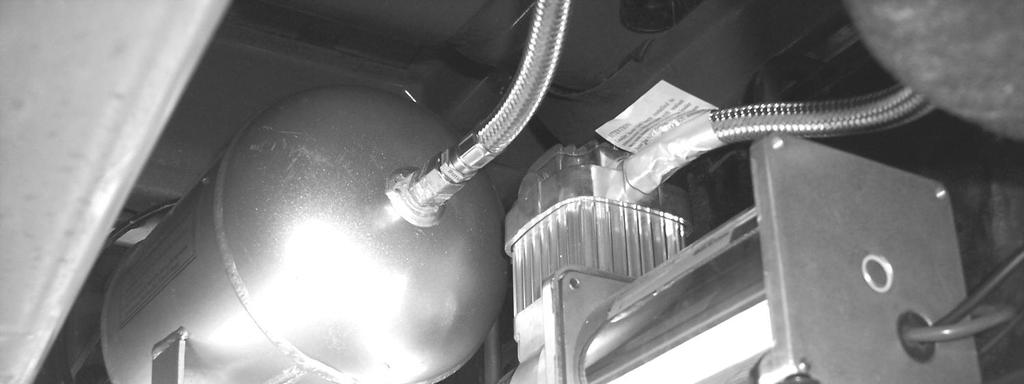 Compressor hose installed to tank. Do not tighten check valve. 16.