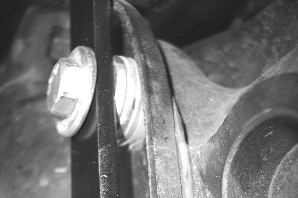 compression of the coil spring under load.