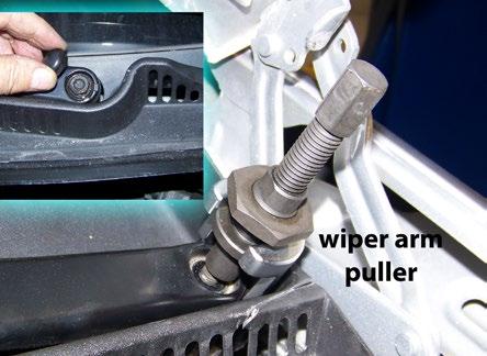 water tray cover). Remove the wiper arms. Pop the plastic buttons and unscrew the wiper arm retaining nuts (inset photo).