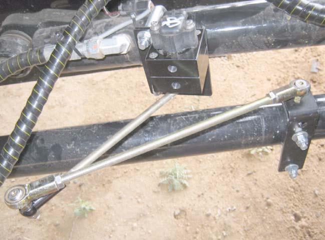 Attaching and Adjusting Wheel Angle Sensor Linkage Rods 9. Disconnect the linkage rods and turn the steering wheel manually to the full left position. 10.