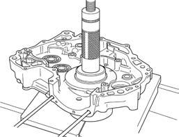 Press a new crankcase bearing into the crankcase using the special tools.