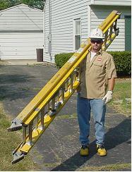 8, face the foot of the ladder and place one arm between the beams at the balance point so that the ladder hangs under