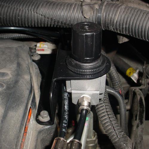 19) Install the regulator mounting bracket on the valve cover as shown below. 20) Install the regulator on the bracket.