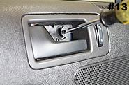 Remove the T30 screw with a Torx driver. Remove trim piece and Torx T30 screw behind the arm rest. Remove trim panel behind the door handle. 2010-2012 Mustang shown. 12.
