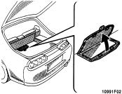Miscellany box Luggage cover Traction control system To open the box, pull up the strap.