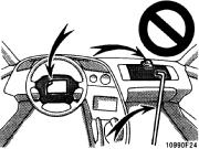 Failure to follow these instructions can result in death or serious injuries. Do not put objects on or in front of the dashboard or steering wheel pad that houses the airbag system.