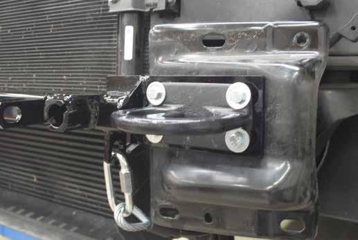5. 2013 Models: Trim the lower radiator shroud as shown for D-Link clearance on the baseplate. Do this on both sides of the vehicle. 6.