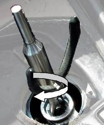 Use long needle-nose pliers to rotate the nylon cup bushing.